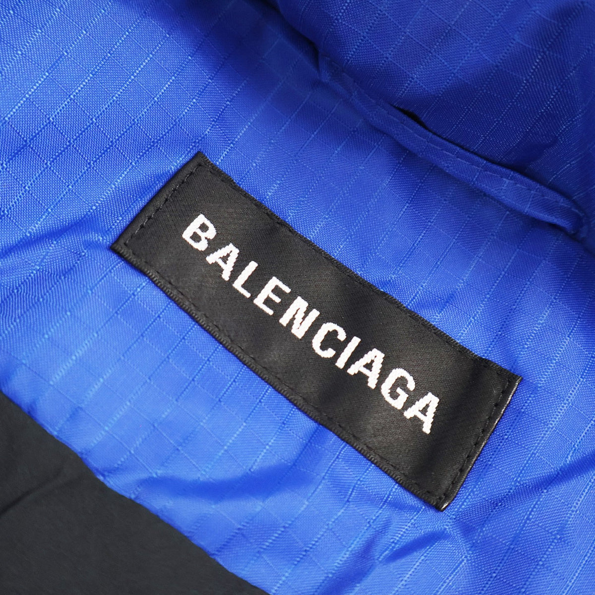 Falection FW26 Quilted Logo Puffer Jacket in Blue